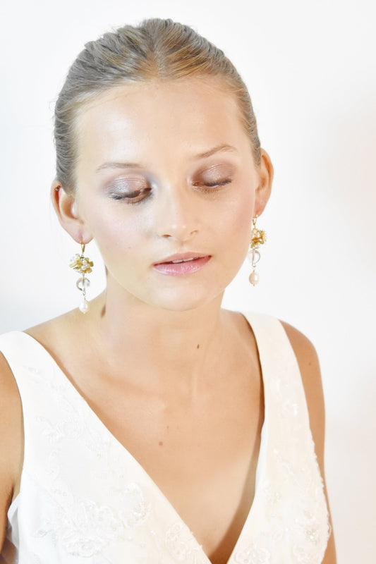 Woman wearing a white dress with a plain background