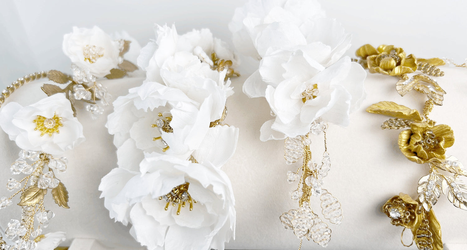 Handmade wedding hair comb with white floral beadwork and gold leaves