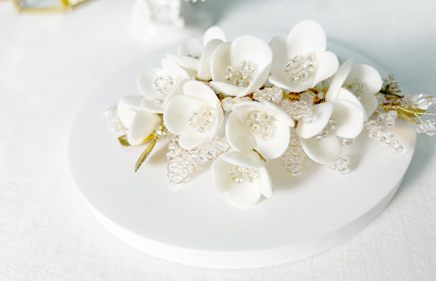 White floral hair accessory on a white plate