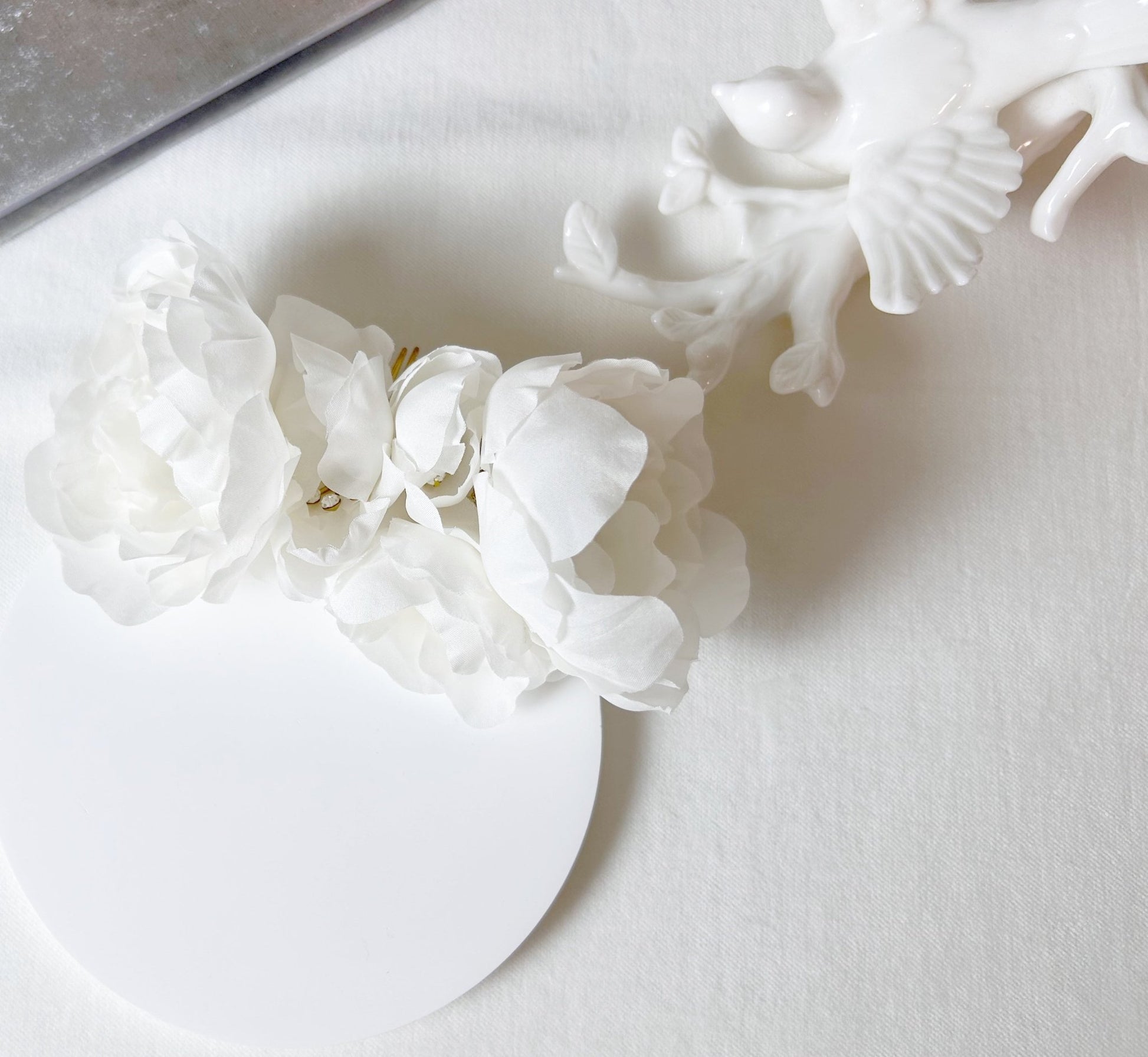 White floral arrangement on a white surface